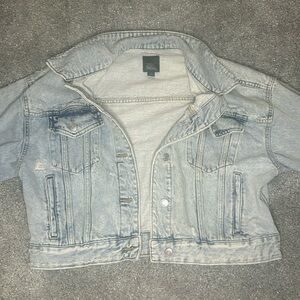 Cropped,light washed,jean jacket,size medium,with loads of detail,with distress.